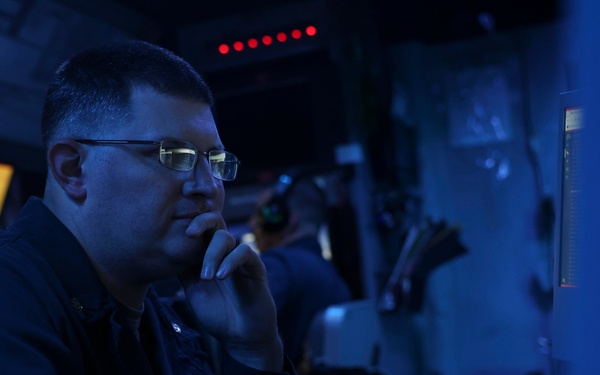 USS Forrest Sherman (DDG 98) Sailors stand watch in CIC.