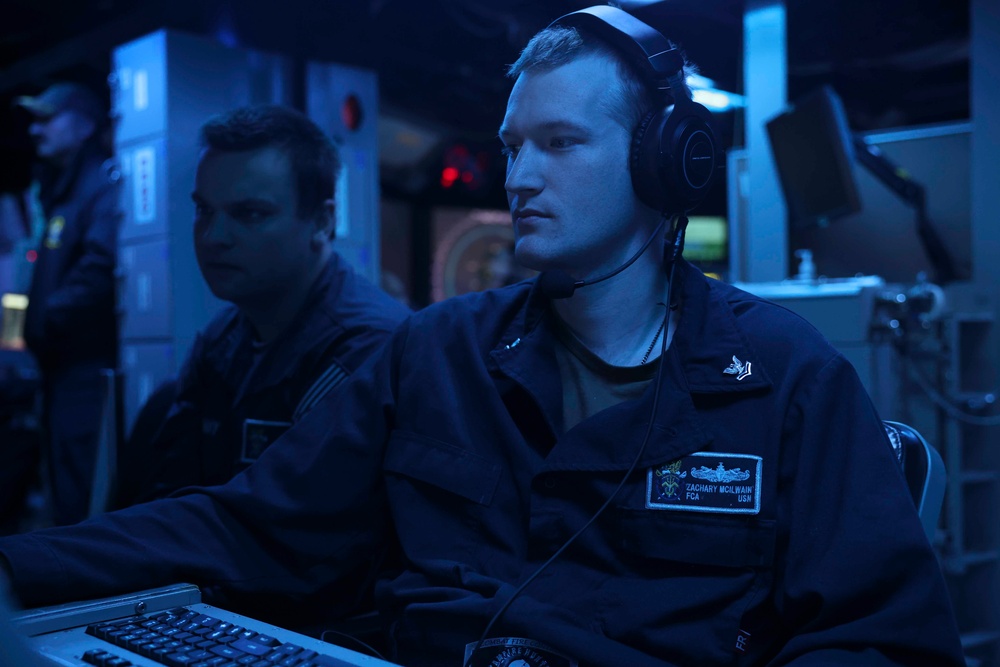 USS Forrest Sherman (DDG 98) Sailors stand watch in CIC.