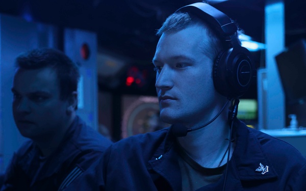 USS Forrest Sherman (DDG 98) Sailors stand watch in CIC.