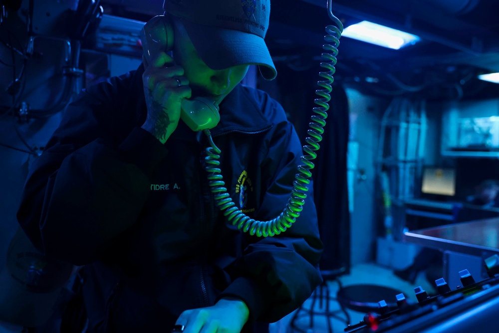USS Forrest Sherman (DDG 98) Sailors stand watch in CIC.