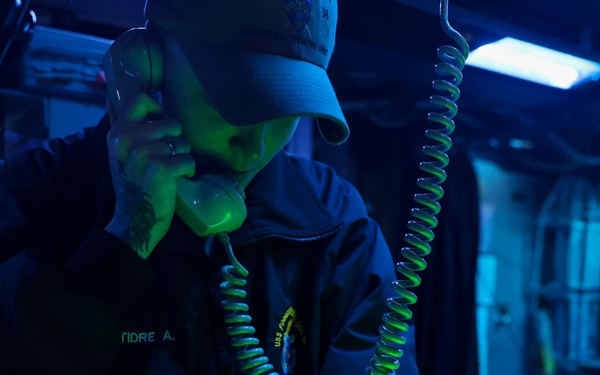 USS Forrest Sherman (DDG 98) Sailors stand watch in CIC.