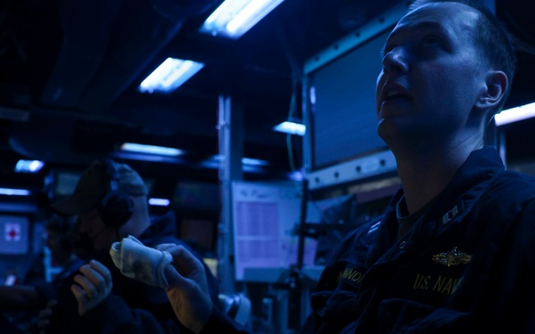 USS Forrest Sherman (DDG 98) Sailors stand watch in CIC.