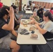 Army Recruiter Sparks Student Curiosity With MRE Demo During Breakout Session
