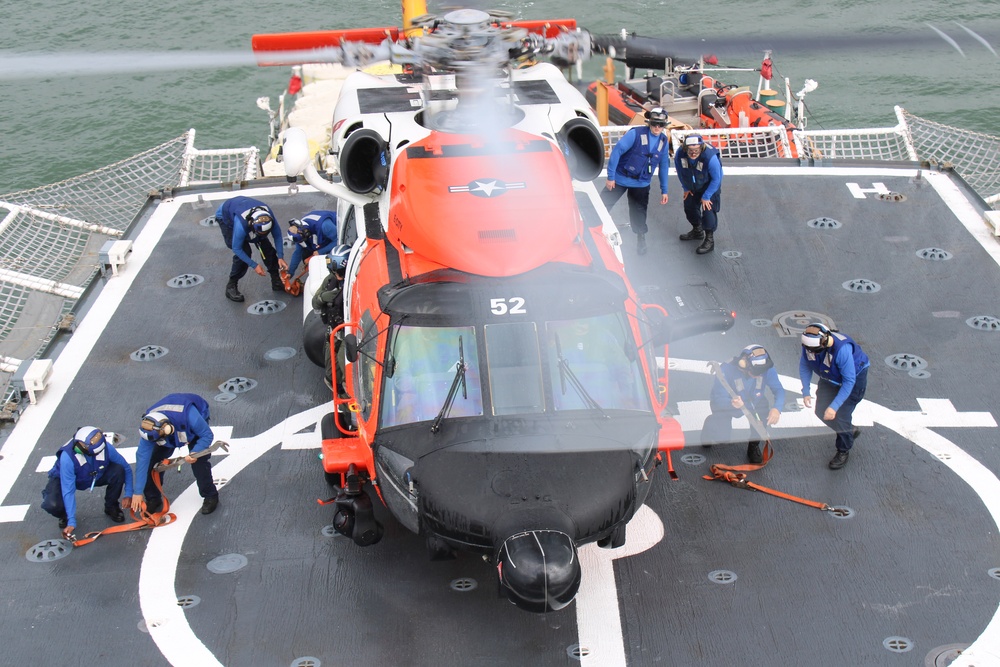 Coast Guard Cutter Escanaba and Air Station Elizabeth City crew members conduct helicopter-ship qualification training in the Chesapeake Bay