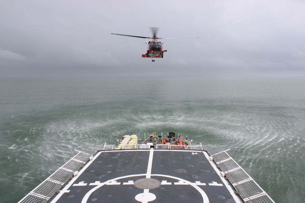 Coast Guard Cutter Escanaba and Air Station Elizabeth City crew members conduct helicopter-ship qualification training in the Chesapeake Bay