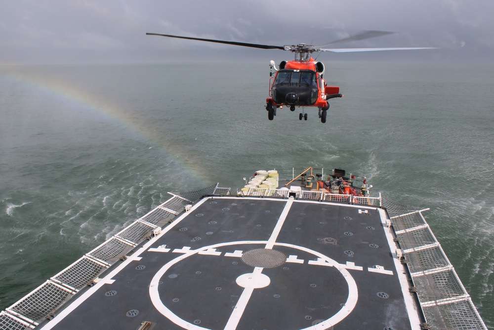 Coast Guard Cutter Escanaba and Air Station Elizabeth City crew members conduct helicopter-ship qualification training in the Chesapeake Bay
