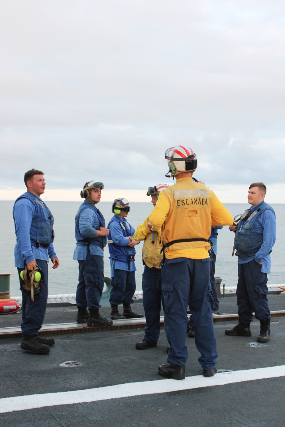 Coast Guard Cutter Escanaba and Air Station Elizabeth City crew members conduct helicopter-ship qualification training in the Chesapeake Bay