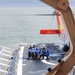 Coast Guard Cutter Escanaba and Air Station Elizabeth City crew members conduct helicopter-ship qualification training in the Chesapeake Bay
