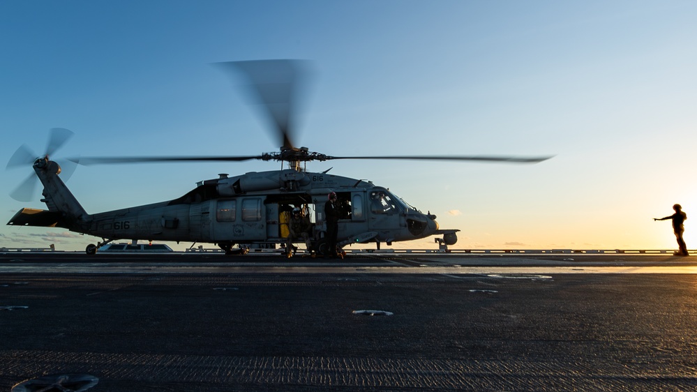 George Washington Conducts Flight Operations at Sunset