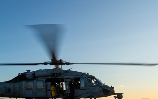 George Washington Conducts Flight Operations at Sunset