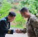 Respect and Recognition: Allies in Arms Share a Moment of Honor