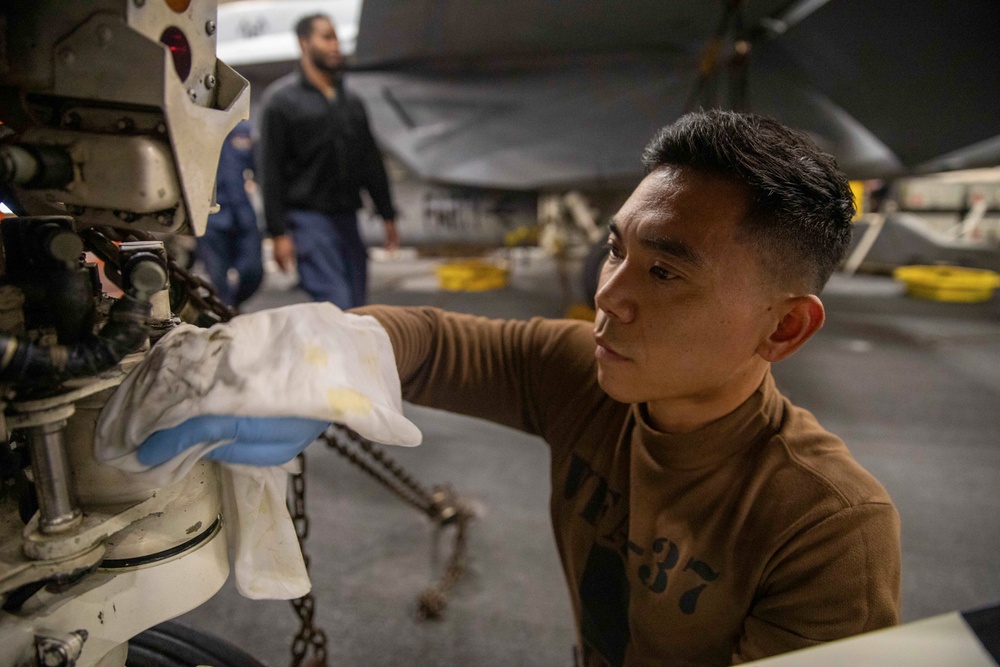 Strike Fighter Squadron 37 Sailor Conducts Maintenance