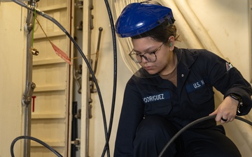 USS Gerald R. Ford (CVN 78) Sailor Conducts Maintenance on SCBA Bottle
