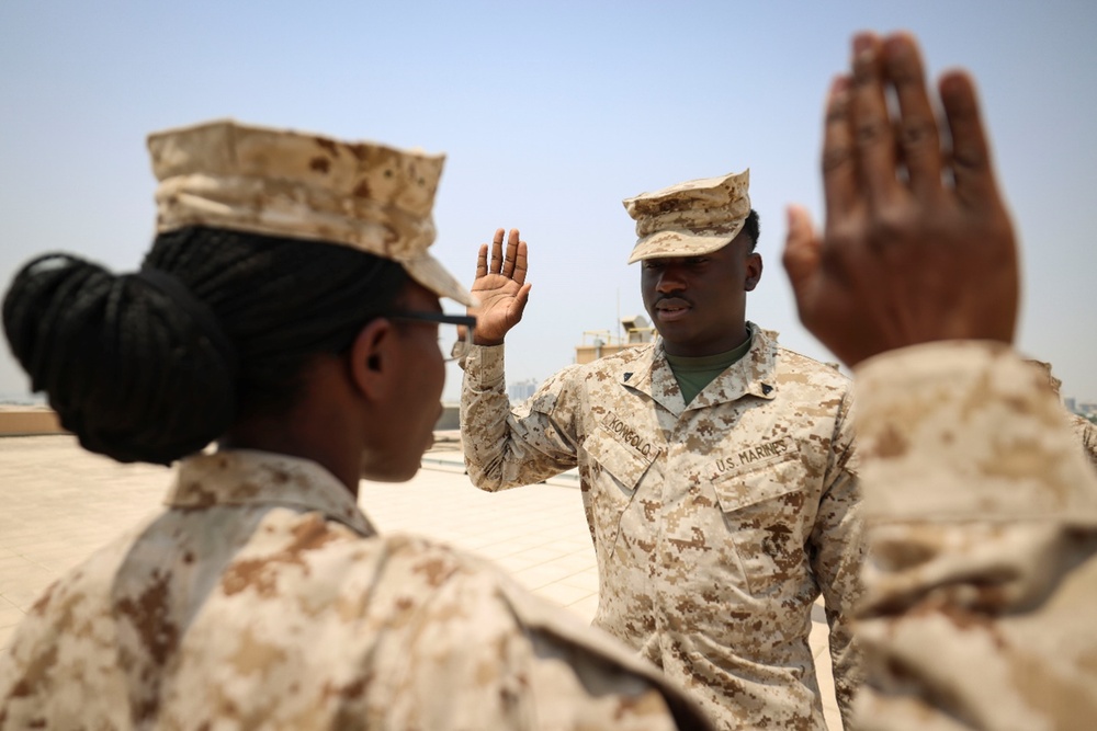 TF 51/5th MEB Marine reenlists on NSA Bahrain