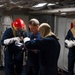 USS Pearl Harbor (LSD 52) Sailors simulate fire response during general quarters drill
