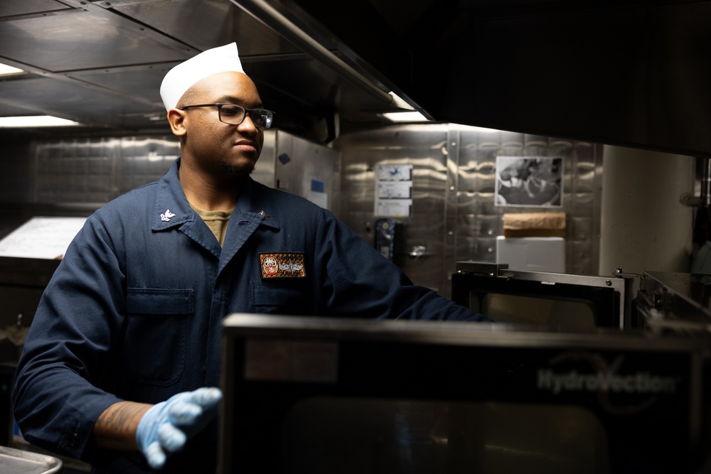 Curtis Wilbur Sailor Prepares Dinner