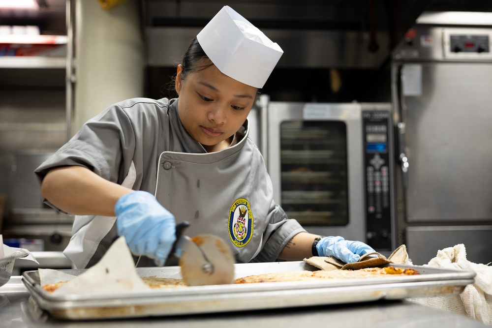 Curtis Wilbur Sailor Prepares Dinner