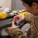 9th PSPTS inspects aircraft vent hose for U-2 high altitude pressure suit