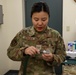 9th PSPTS inspects aircraft vent hose for U-2 high altitude pressure suit