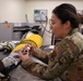 9th PSPTS inspects aircraft vent hose for U-2 high altitude pressure suit
