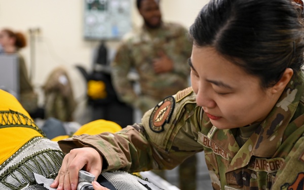 9th PSPTS inspects aircraft vent hose for U-2 high altitude pressure suit