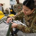 9th PSPTS inspects aircraft vent hose for U-2 high altitude pressure suit