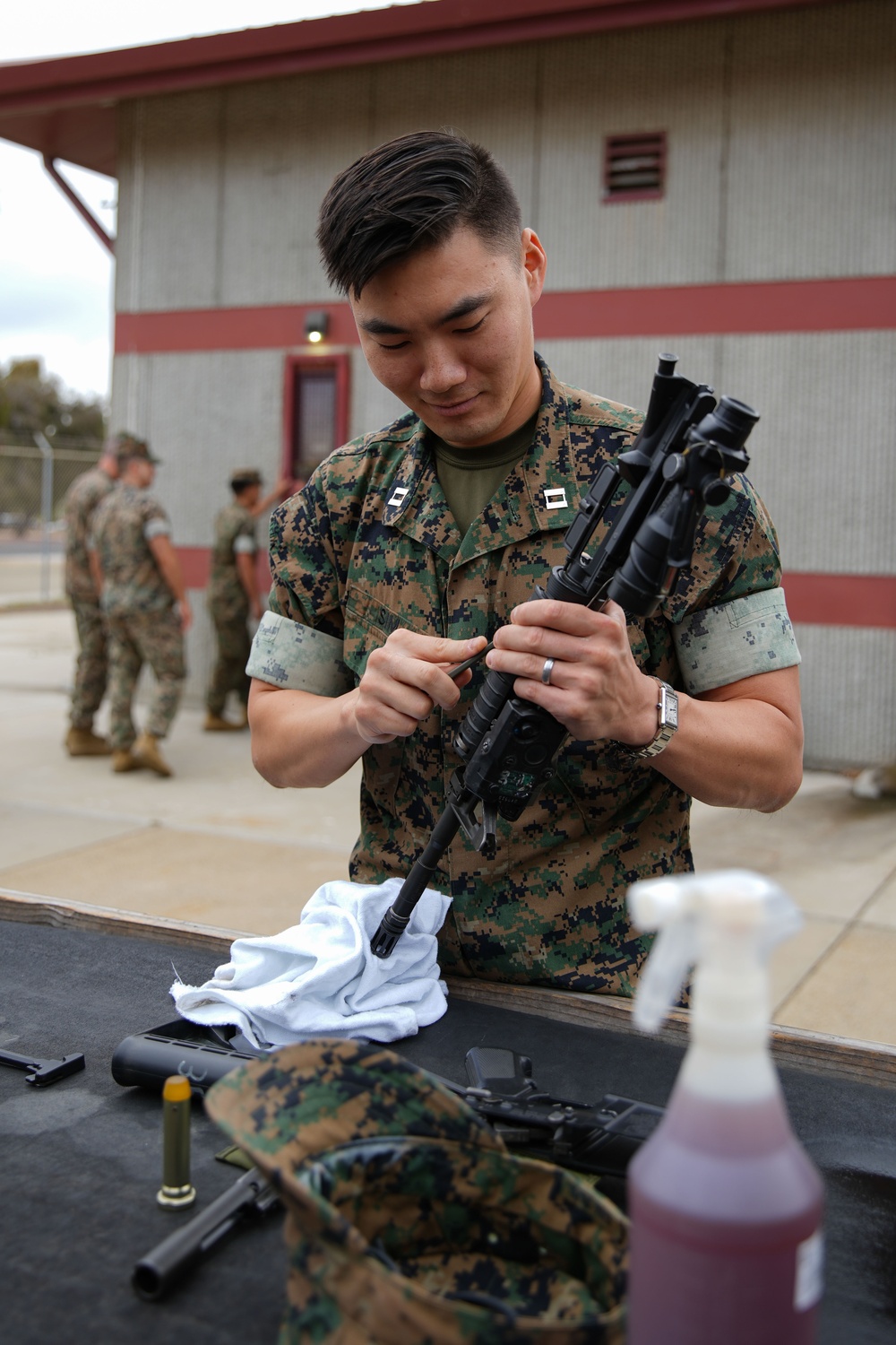 11th MEU Marines perform rifle maintenance