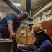 Contractors perform maintenance aboard USS Ronald Reagan