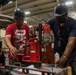 Contractors perform maintenance aboard USS Ronald Reagan