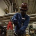 Contractors perform maintenance aboard USS Ronald Reagan
