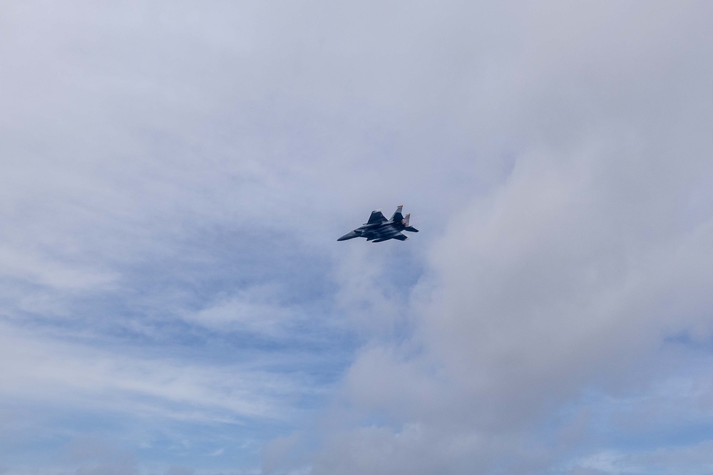 336th Fighter Squadron Conducts a Fly-by as USS Ralph Johnson (DDG 114) Departs Diego Garcia
