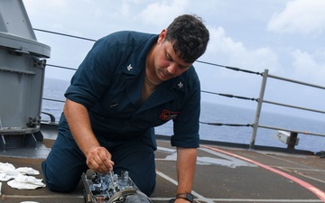 USS Pearl Harbor (LSD 52) Sailors Conduct Weapon Maintenance