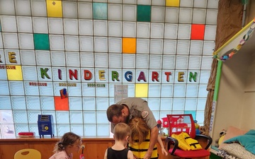 Tulsa District park ranger visits library to read Bobber the Water Safety dog book to children