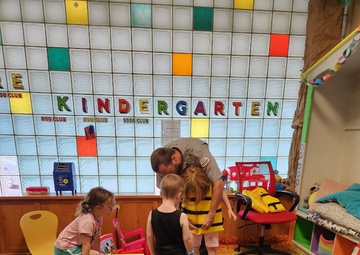 Tulsa District park ranger visits library to read Bobber the Water Safety dog book to children
