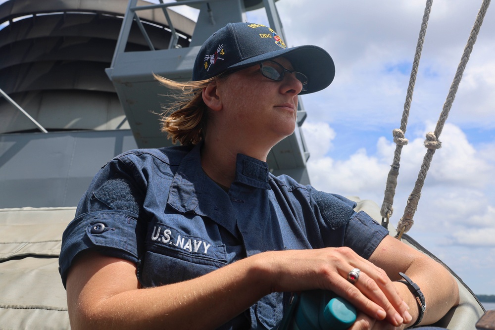 QMSN Lisa Gourlay observes the horizon from the weather decks