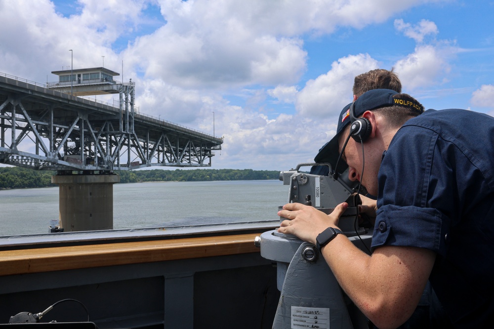 QMSN Jace Orourke observes the bearing of an approaching contact with an alidade