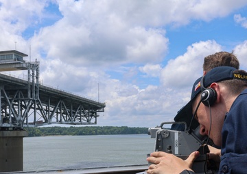 QMSN Jace Orourke observes the bearing of an approaching contact with an alidade