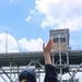 Midshipman Ashley Sarno waves to Coleman Memorial Bridge personnel from the portside bridge wing