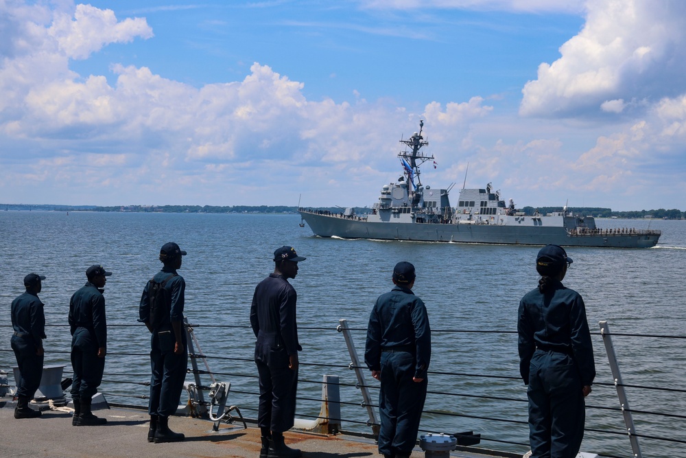 USS Bulkeley Sailors man the rails while passing the USS Thomas Hudner (DDG 116)