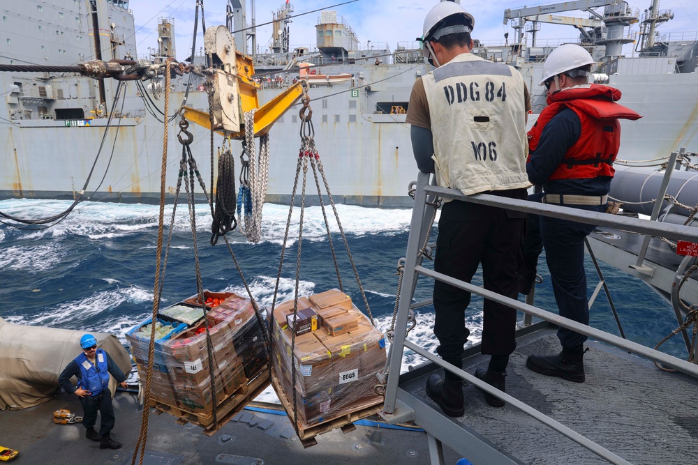 BM3 James Mark Monje, BM1 Jason Carpenter and ITC David Cummings conduct a replenishment-at-sea