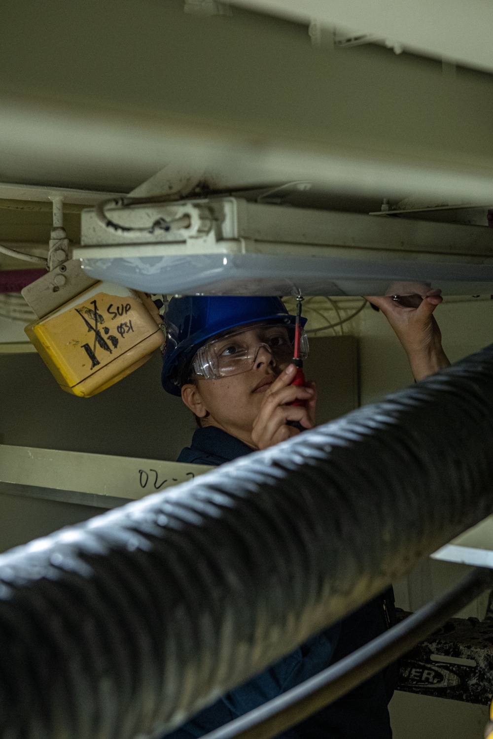 Headline: Ronald Reagan Sailors and Contractors Conduct Maintenance