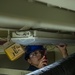 Headline: Ronald Reagan Sailors and Contractors Conduct Maintenance