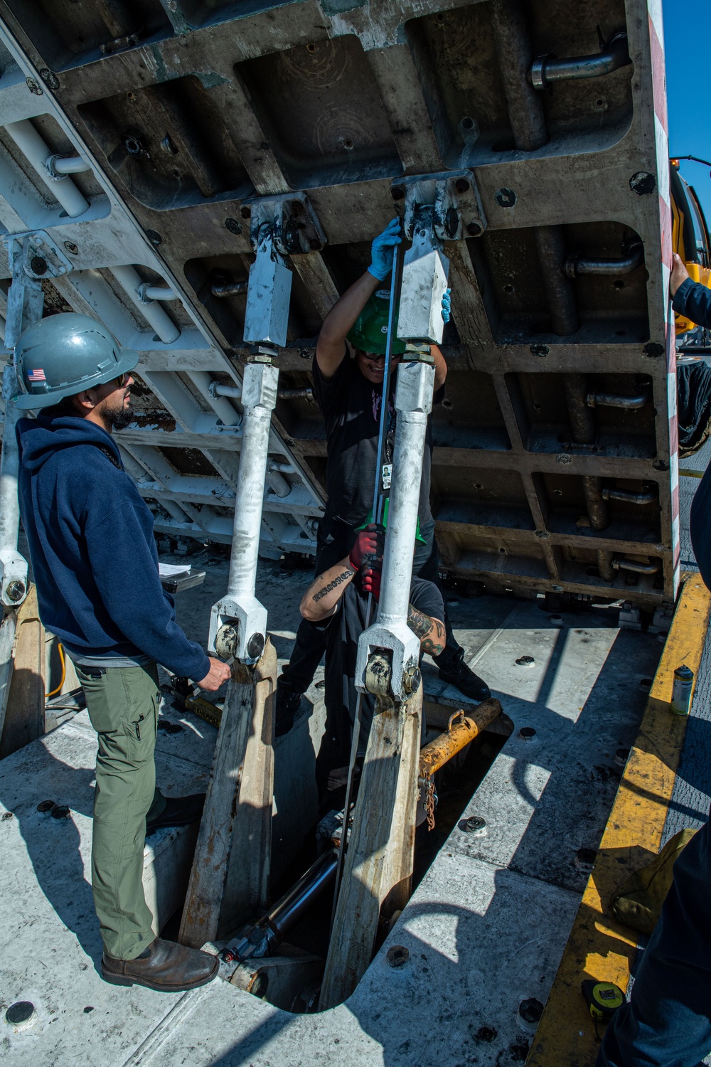 Headline: Ronald Reagan Sailors and Contractors Conduct Maintenance