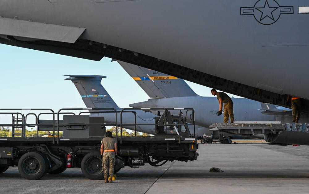 Airmen in Action: 735 AMS Airmen perform routine aircraft loading operations