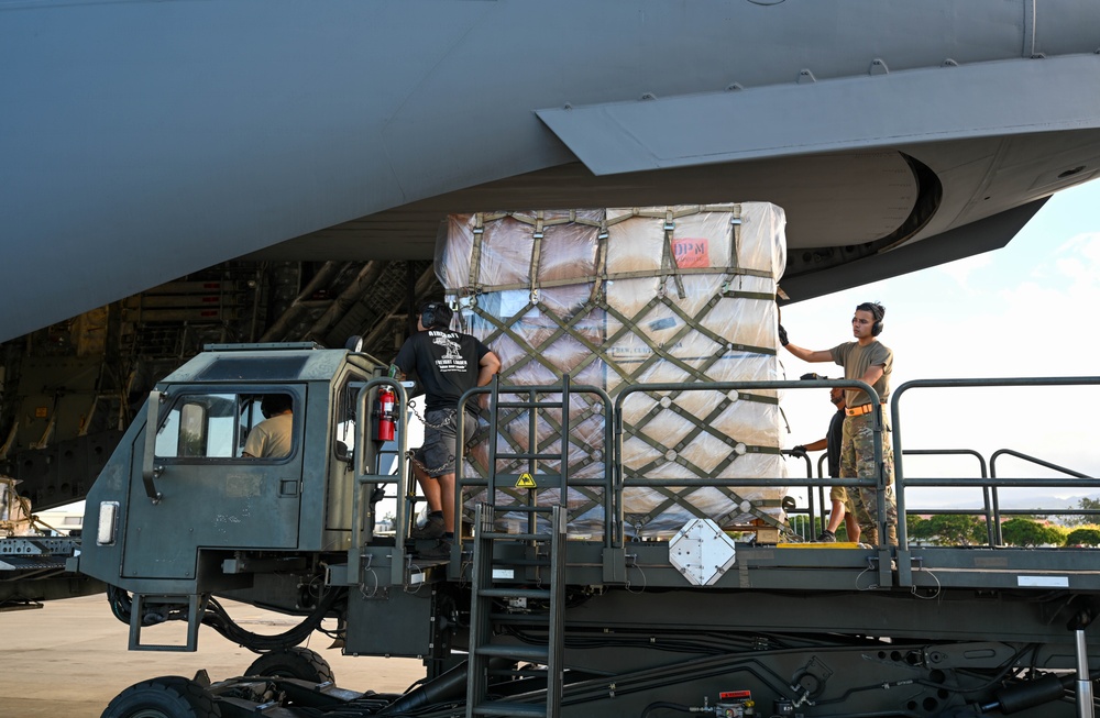 Airmen in Action: 735 AMS Airmen perform routine aircraft loading operations