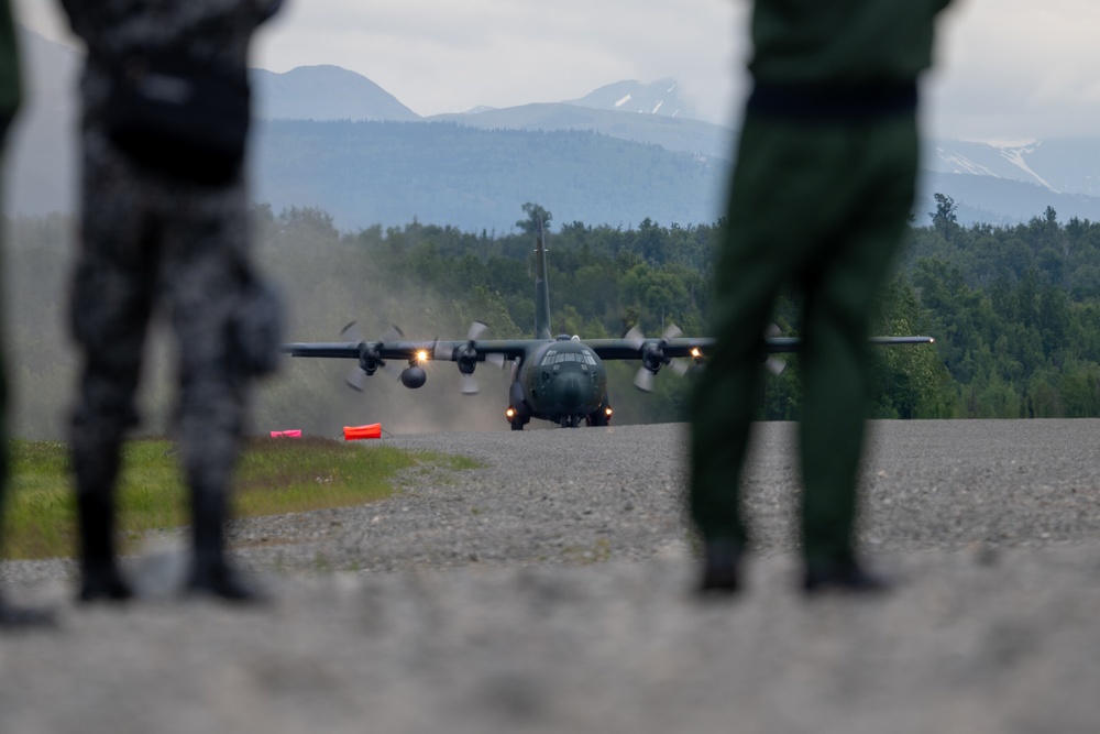 JASDF, USAF aircraft launch from  Malemute Drop Zone