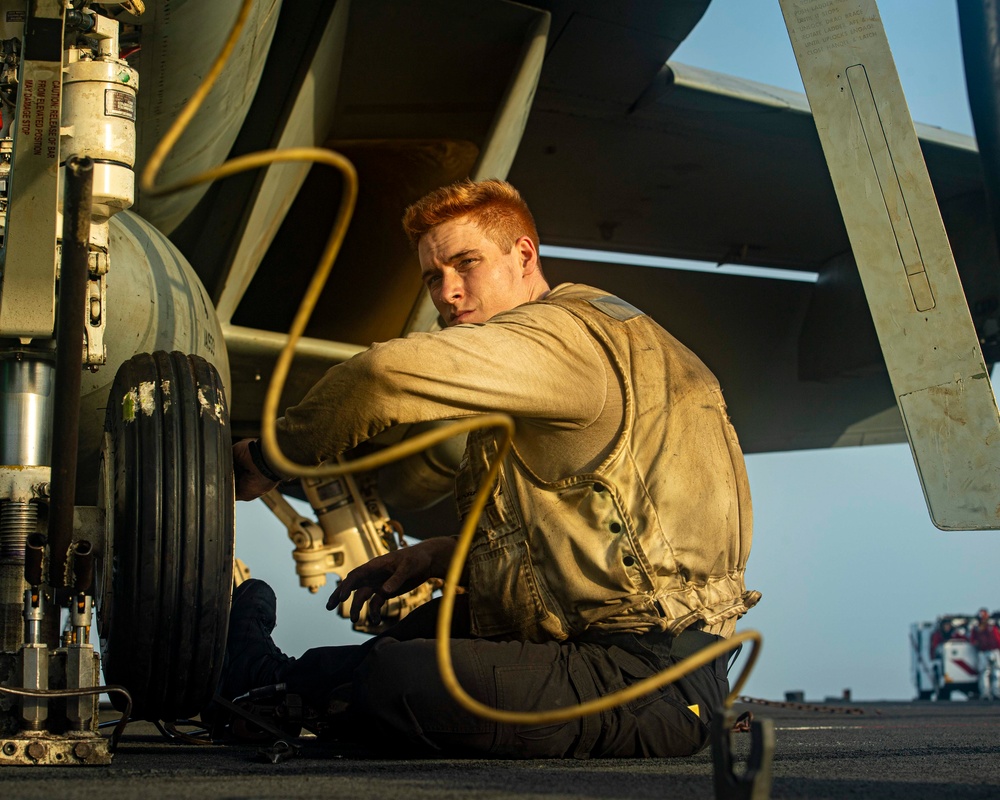 Nimitz Sailors Conduct Routine Maintenance on Aircraft
