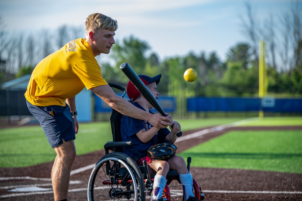 Sailors play baseball with local children during Navy Week Milwaukee 2025