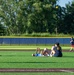 Sailors play baseball with local children during Navy Week Milwaukee 2025