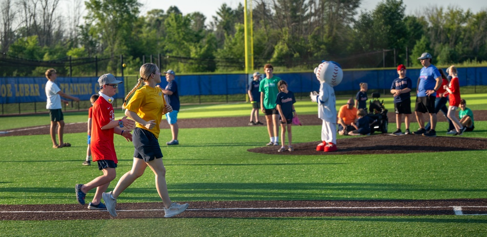 Sailors play baseball with local children during Navy Week Milwaukee 2025